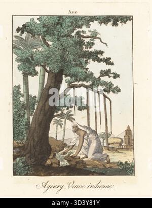 Hinduwitwe, die sati überlebt hat und Aghori geworden ist. Sie lebt ein asketisches Leben im Wald, verdammt, Wasser von einem menschlichen Schädel zu trinken. Frau in weißem Sari an einem Frühling in der Nähe eines Banyan-Baumes. Agoury, Veuve Indienne. Nach Frans Balthazar Solvyns in Les Hindous. Handkolorierter Kupferstich aus Moeurs et Coutumes des Peuples ou Collection de Tableaux représentant les usages remarquables, les mariages, funérailles, supplices et fêtes des diverses Nations du Monde, Manners and Customs of Peoples, Veuve Hocquart, Paris, 1811. Stockfoto