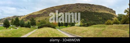Ein Panorama von Arthur's Seat und Salisbury Crags, Holyrood Park. Dieser erloschene Vulkan ist eine beliebte Touristenattraktion am Rande von Edinburgh, Scotlan Stockfoto