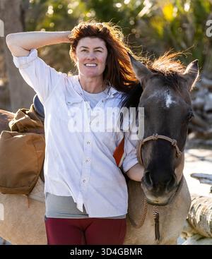 Reiten auf Marsh Tacky Horses auf Daufuskie Island. Stockfoto