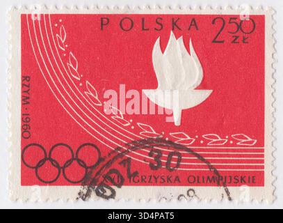 POLEN — 15. Juni 1960: 2,50 Zloty rot-schwarze Briefmarke mit geprägter Olympischer Flamme. Polnische Olympische Siege: Olympische Spiele in Rom, Italien, 25. Juli bis 11. September Stockfoto