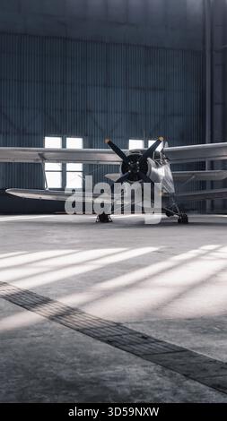 Vorderansicht eines alten Propellerflugzeugs in einem Hangar. 9x16 vertikale Abbildung eines weißen zweiflügeligen Flugzeugs in geräumigem, sonnendurchflutetem Hangar. Stockfoto