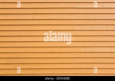 Hintergrund einer bemalten gelben Dielenwand Stockfoto