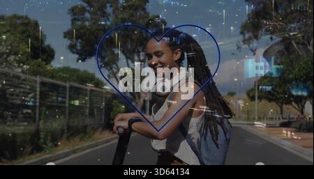 Stehende Frau mit Dreadlocks in gestreiftem Oberteil mit E-Scooter auf der Straße mit blauem Herzen Stockfoto