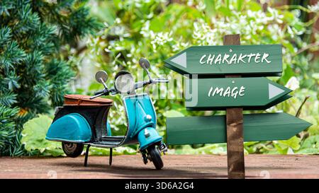 Ein Bild mit einem Wegweiser, der in zwei verschiedene Richtungen auf Deutsch zeigt. Eine Richtung ist nach Zeichen, die andere nach Bild. Stockfoto