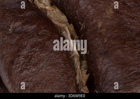 Extreme Makroaufnahme der Textur gerösteter Kaffeebohnen Stockfoto