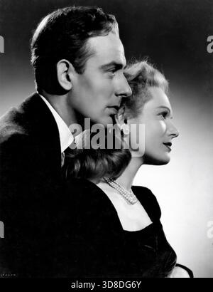 MICHAEL WILDING und ANNA NEAGLE Porträt im FRÜHJAHR IN PARK LANE 1948 Regisseur HERBERT WILCOX Drehbuch Nicholas Phipps aus dem Roman Come Out of the Kitchen von Alice Duer Miller Musik Robert Farnon Miss Neagle's Dresses Kitty Foster Productions Herbert Wilcox und Anna Neagle Herbert Wilcox Productions / British Lion Film Corporation Stockfoto