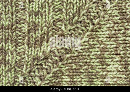 Grün melierte Wollgarn-Strickmuster als Hintergrund Stockfoto