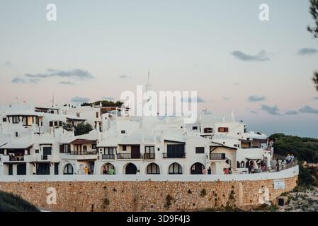 White Coastal Village Architecture in Binibeca Vell at Sunset, Menorca Stockfoto