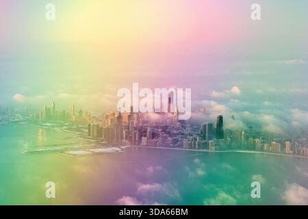 Aus der Vogelperspektive von Chicago, Illinois, an einem Wintertag mit berühmten Wolkenkratzern wie Willis Tower und Hancock Building inmitten von Wolken. Stockfoto