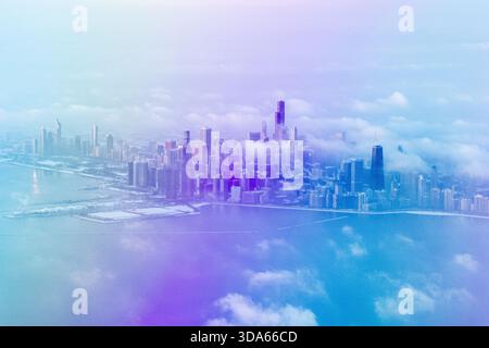 Aus der Vogelperspektive von Chicago, Illinois, an einem Wintertag mit berühmten Wolkenkratzern wie Willis Tower und Hancock Building inmitten von Wolken. Stockfoto