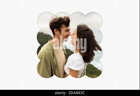 Ein Paar, das an einem bewölkten Tag draußen in der Nähe der Küste einen fröhlichen Moment teilt Stockfoto