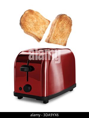 Gebräunte Brotscheiben fliegen aus dem Toaster auf weißem Hintergrund Stockfoto