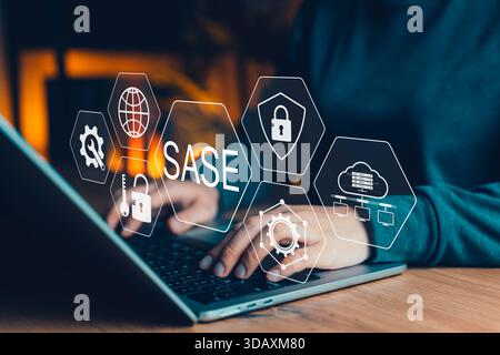 SASE-Cybersicherheitskonzept. Handtipp auf einem Laptop mit virtuellen Symbolen für sicheren Zugriff auf Service Edge, Schutz des Cloud-Netzwerks und IT-Sicherheit Stockfoto