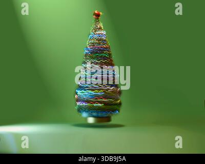 Nahaufnahme eines bunten Weihnachtsbaumschmucks aus Glas vor grünem Hintergrund Stockfoto