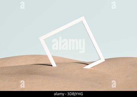 Weißer Bilderrahmen in einer Sandwüste unter einem klaren blauen Himmel, der einen minimalen und abstrakten Landschaftshintergrund schafft Stockfoto