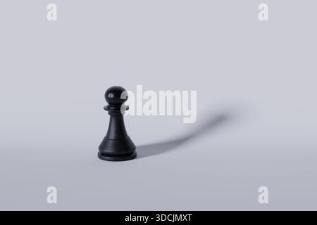 Schwarzes Schachstück mit Schatten auf weißem Hintergrund. Strategie, kreative Idee. Erfolg und Denken, Konzept Stockfoto