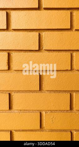 Nahtlose orangefarbene Ziegelwand-Textur mit sauberer Oberfläche und sichtbaren Fugenlinien moderner architektonischer Hintergrund für Gebäude-Außen- oder Innendesign Stockfoto