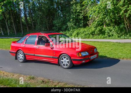 1989 80er Jahre Red Ford Sierra Xr4x4 i Allradantrieb (AWD) Hatchback Car Benzinmotor 2933 ccm, (2,9 l) Kölner V6-Motor; auf der Lytham Hall Oldtimer und Performance, Sammler und Enthusiasten Motorshow. UK Stockfoto
