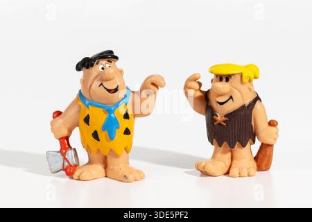 Die Figuren Fred Flintstone und Barney kommunizieren mit Gesten Stockfoto