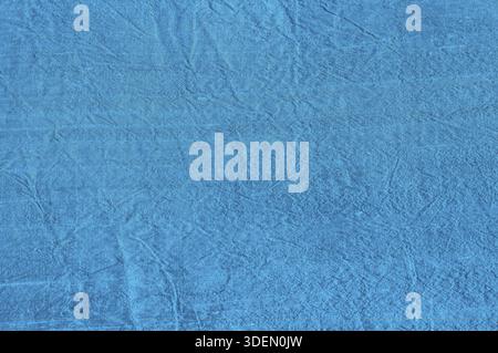 Textur aus blauem Seidenstoff mit Schlankung als textiler Hintergrund Stockfoto