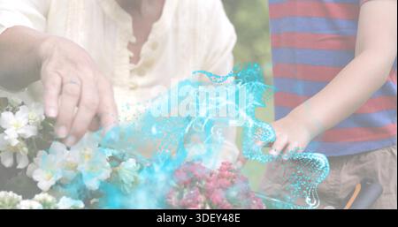Arbeitender Senior und Junge im Blumenbeet, cremefarbene Oberseite, gestreiftes T-Stück, türkisfarbene Wirbel, beringte Hand, Hochentaster Stockfoto