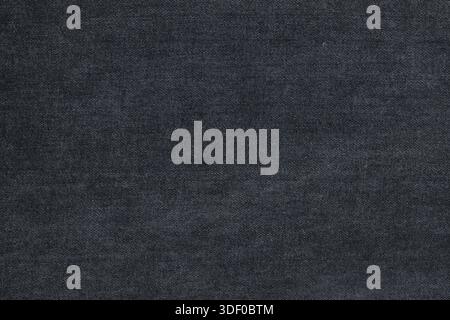 Textur aus Jeans-Material für den Hintergrund. Dunkler Jeans-Hintergrund Stockfoto