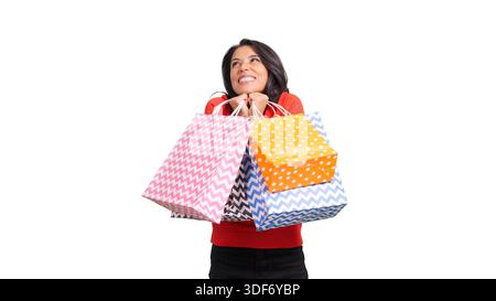 Glückliche Frau, die Einkaufstaschen hält, um die Retail-Therapie zu feiern Stockfoto