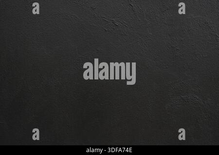 Leere schwarz lackierte Wand für Hintergrund. Stockfoto