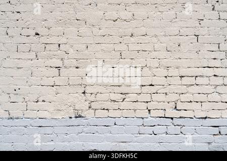 Alte weiße Ziegelwand. Abstrakter Innenhintergrund. Stockfoto