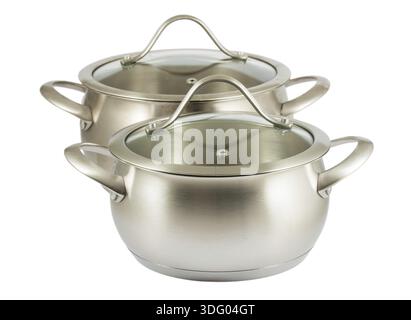 Paar Dampfkochtöpfe mit Deckeln auf weißem Hintergrund Stockfoto
