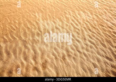Struktur von Sand. Wüstensand Hintergrund. Abstrakte Textur der marokkanischen Wüste. Stockfoto