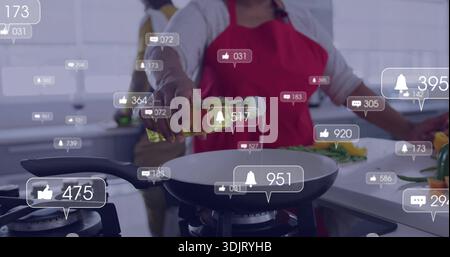 Ältere schwarze Frau in rote Schürze gießen, Öl in die Pfanne in der Küche geben, Livestream-Symbole Stockfoto