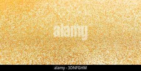 Hintergrund mit goldenem Glitzer und Pailletten Stockfoto