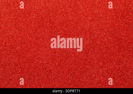 Hintergrund mit rotem Glitzereffekt für festliches Weihnachtsdesign Stockfoto