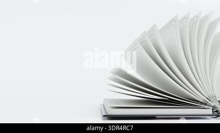 Das Buch ist geöffnet und die Seiten sind aufgefächert. Seiten enthalten keinen Text oder Bilder. Das Buch liegt auf einer Ebenen Oberfläche auf, sodass die leeren Seiten gut sichtbar sind Stockfoto