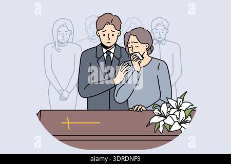 Die Leute bei der Beerdigung stehen neben dem Sarg mit katholischem Kreuz und trauern um den Tod, um sich zu verabschieden Stockfoto