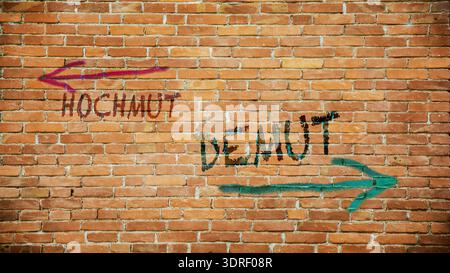 Wegweiser auf direktem Weg zu Demut versus Hochmut Stockfoto