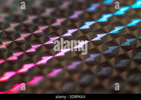 Holographische Textur. Wunderschöner schillernder und glitzernder Hintergrund. Wunderschönes bunt gefärbtes Bokeh. Die Kulisse besteht aus glänzender Sequenz Stockfoto