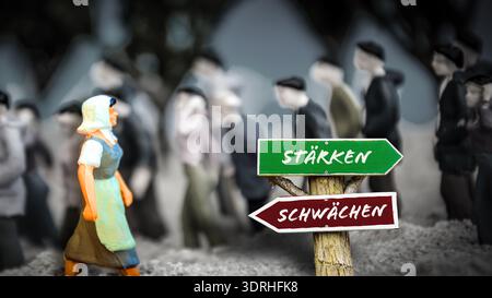 Ein Bild mit einem Wegweiser, der in zwei verschiedene Richtungen auf Deutsch zeigt. Eine Richtung verweist auf Stärken, die andere auf Stockfoto