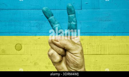 Victoy-Schild an einer Betonwand Stockfoto
