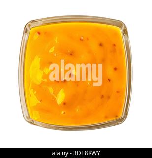 Honigsenfsauce mit sichtbaren Gewürzen in einer Glasschale, Studioaufnahme, transparenter Hintergrund Stockfoto