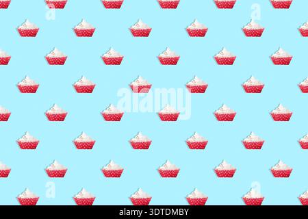 Nahtloses Muster, Cupcake auf blauem Hintergrund Stockfoto