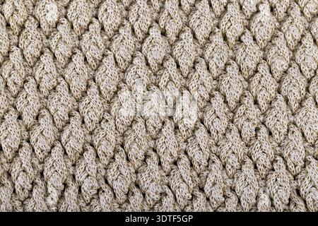 Textur der Beige gestrickte Wollstoff für Tapeten und einem abstrakten Hintergrund Stockfoto