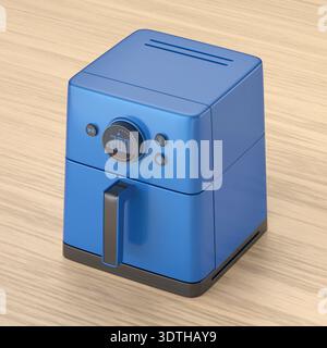 Blaue elektrische Luftfritteuse auf Holztisch Stockfoto