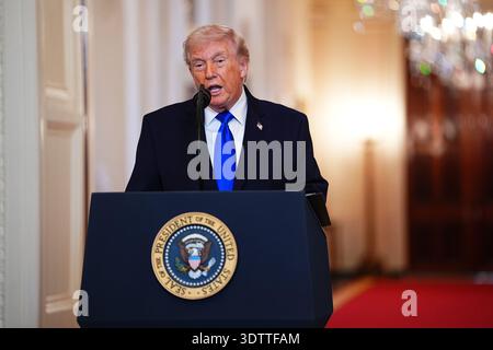 Washington, United States. 23rd Feb, 2026. President Donald Trump speaks during an Angel Families Remembrance Ceremony in the East Room of the White House in Washington, DC on Monday, February 23, 2026. Trump signed a proclamation declaring February 22 as "Angel Family Day" to honor families who have lost loved ones to crimes committed by individuals in the country illegally or undocumented immigrants. Photo by Aaron Schwartz/UPI Credit: UPI/Alamy Live News Stockfoto