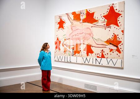 London, Großbritannien. 24. Februar 2026. Ein Mitarbeiter mit „Pink Skater (will I Win, will 1 Win)“, 2015, bei einer Vorschau von „Rose Wylie: The Picture Comes First“, der größten Übersicht über das Werk von Rose Wylie, RA, an der Royal Academy of Arts. Die Ausstellung präsentiert über 90 ihrer Werke vom 28. Februar bis 19. April 2026. Quelle: Stephen Chung / Alamy Live News Stockfoto