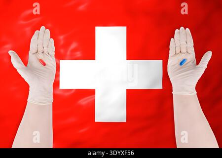 Mediziner in Handschuhen, die rote und blaue Kapseln über der Schweizer Flagge halten. Konzept der Gesundheitswahl und Pharmaindustrie in der Schweiz Stockfoto