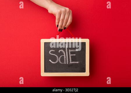 Der Verkauf steht auf der Schultafel Stockfoto
