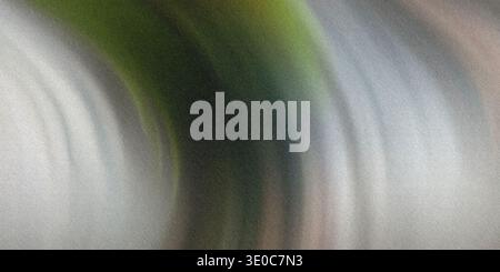 Ein Bild mit einem unscharfen, abstrakten Hintergrund mit einem dominanten grünen Element, das sich durch gedämpfte Grautöne kurvt. Der Effekt ist weich und geschmeidig. Stockfoto