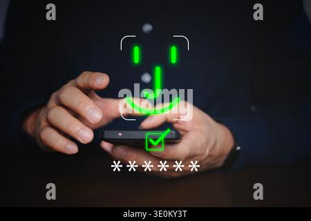 Hände, die ein Smartphone mit Gesichtserkennungssymbol, Kennwortsymbolen und Genehmigungsprüfung verwenden, die biometrische Anmeldung, Identitätsprüfung, mobi Stockfoto